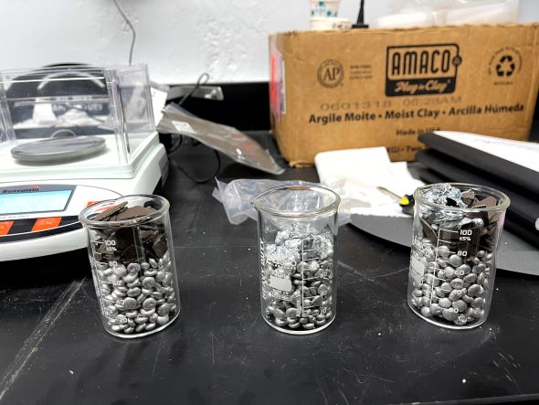 Containers filled with metal pellets used in lab experiment