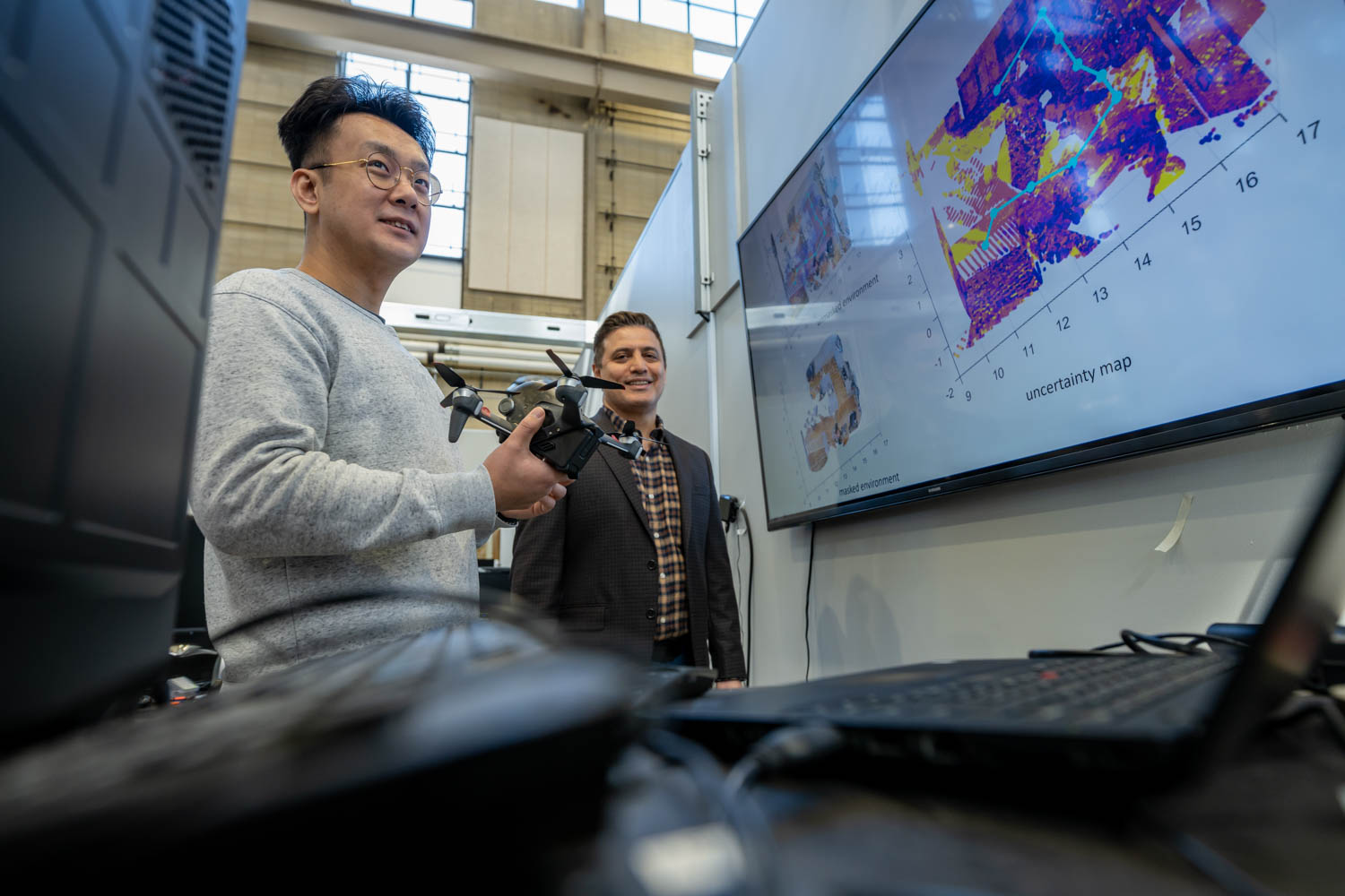 Guangyi Liu and Nader Motee in AIR Lab 