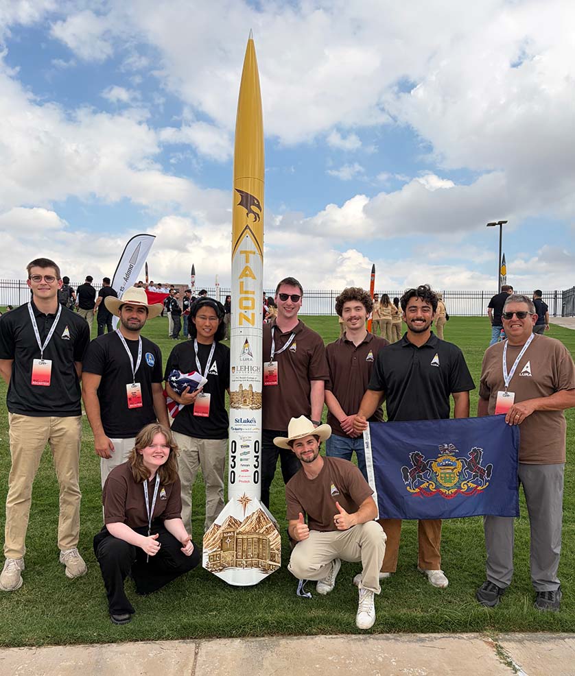 Group shot of LURA team members and their rocket, Talon