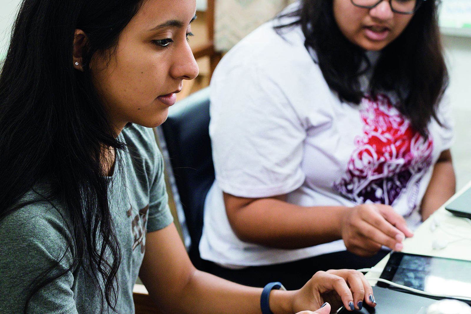 Two Lehigh graduate students working together at a computer workstation