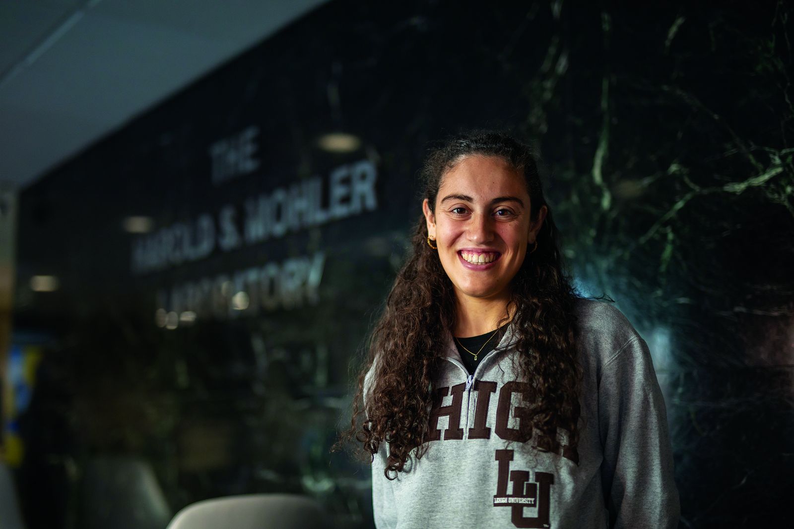 A Lehigh graduate student outside the Harold S. Mohler Laboratory, home of industrial and systems engineering