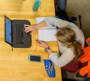 Overhead shot of woman using laptop