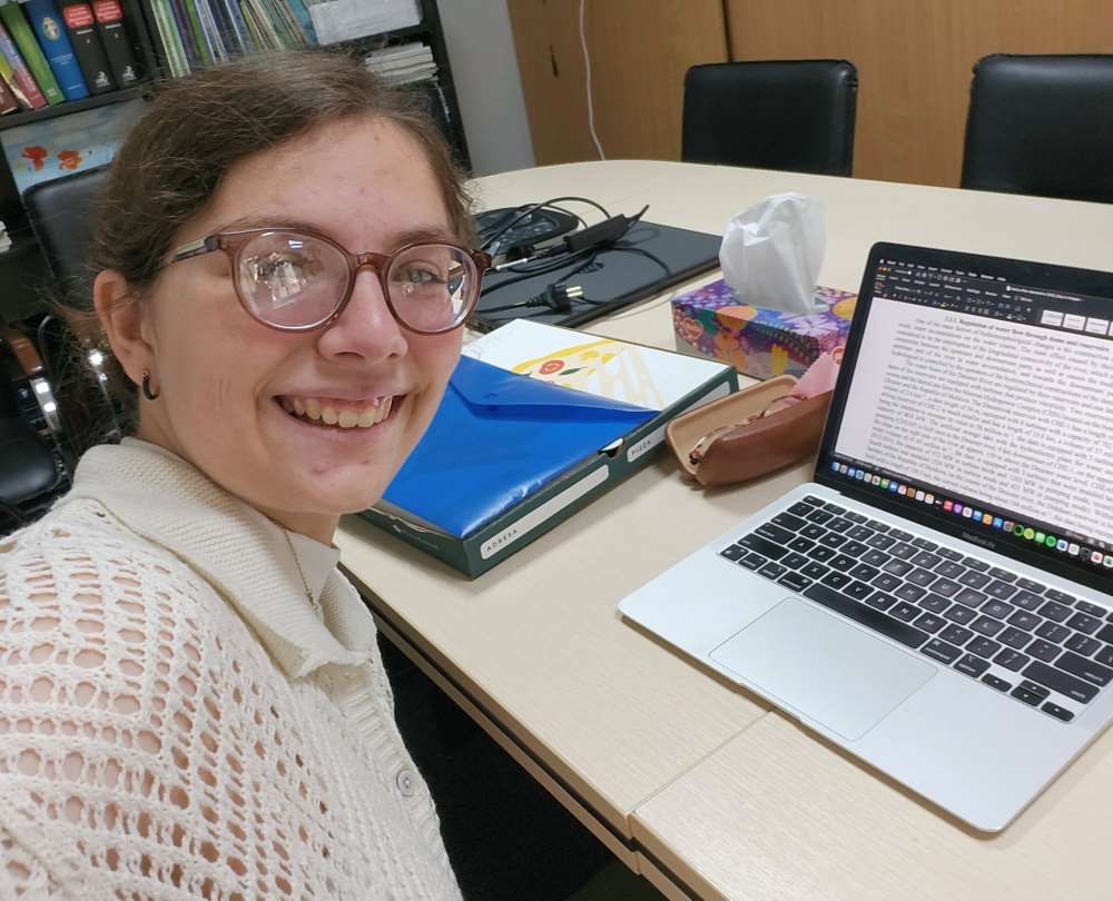 Emily Buchanan working on computer at EcoConnect