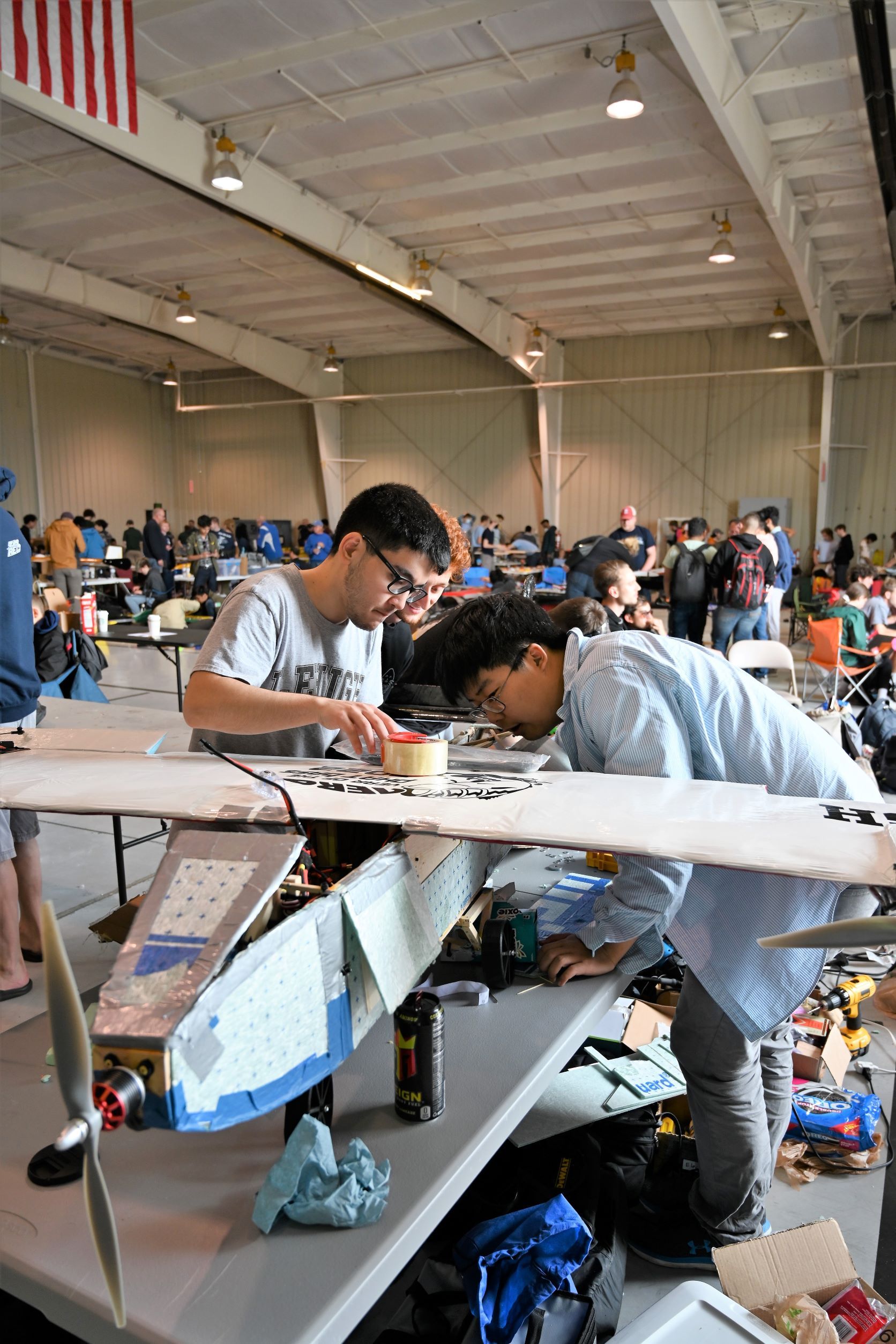 LU Aero team members fixing aircraft