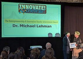 Lehman accepting award