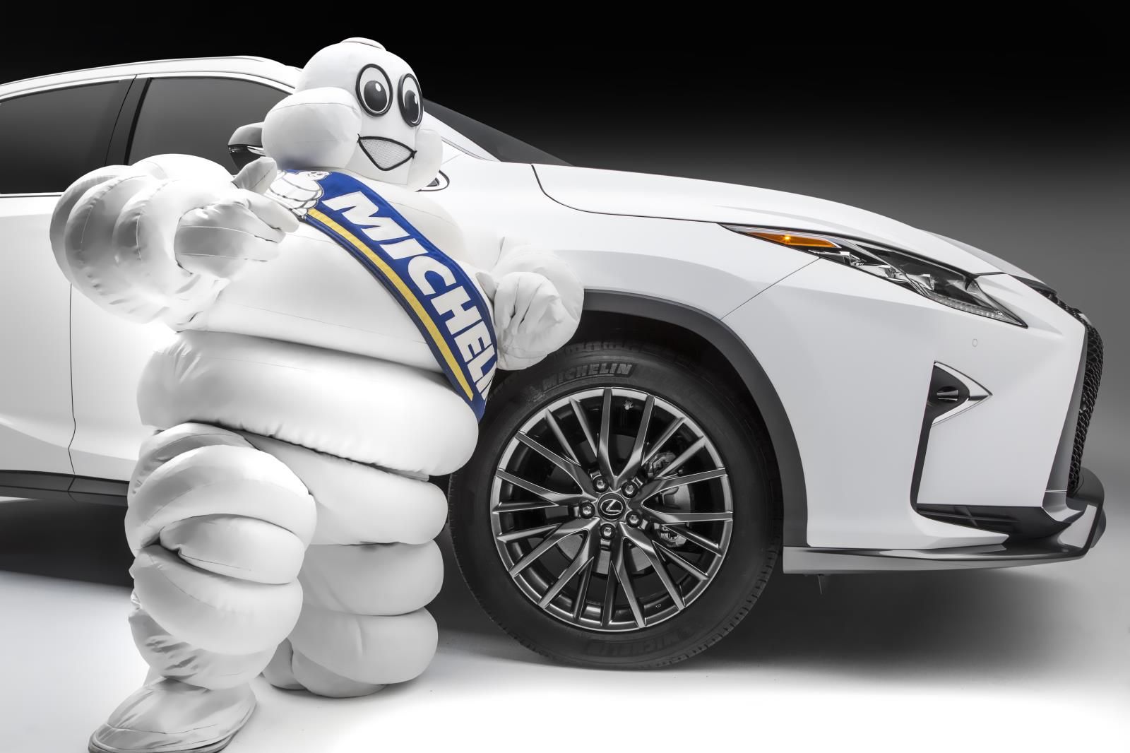 Michelin man with car tire
