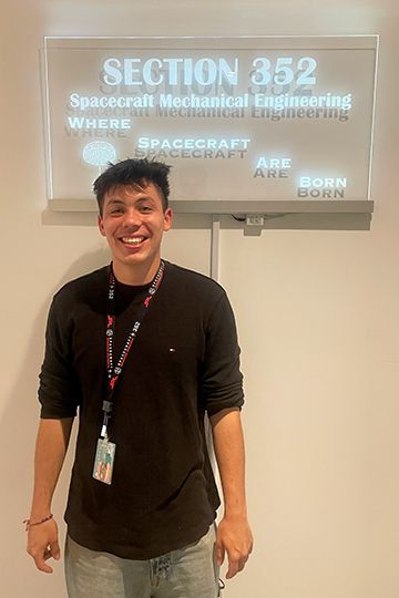 Jack Riffle next to sign at JPL