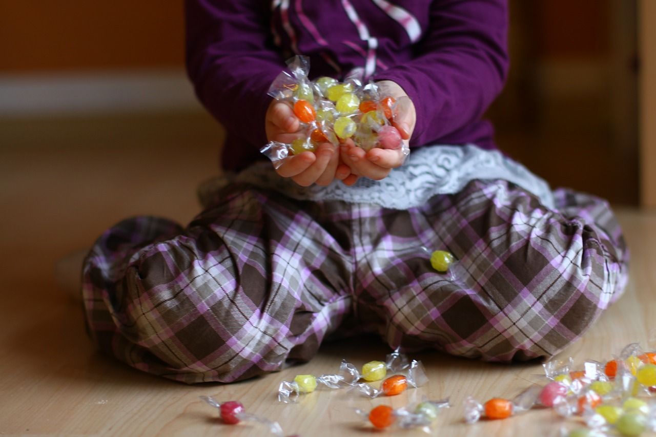 kid holding candy