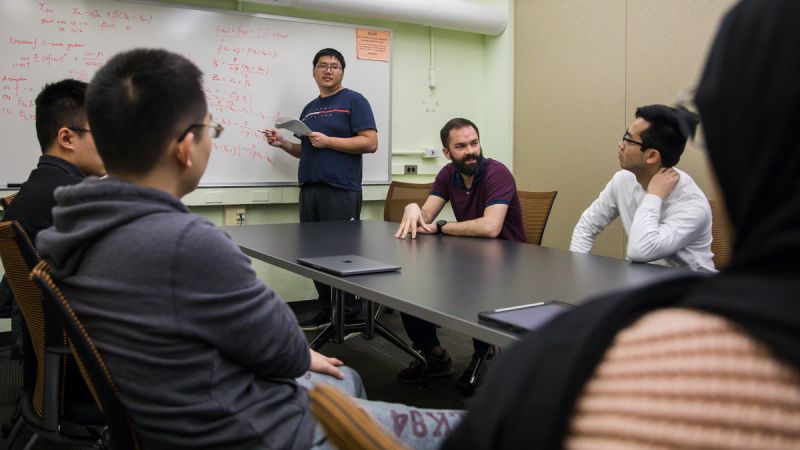 Frank E. Curtis with grad students