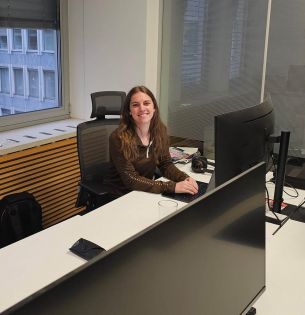 Kaja Skerlj sitting at a desk 
