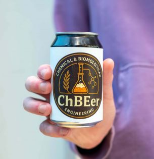 Hand holding a can of ChBEer made in the brewing class