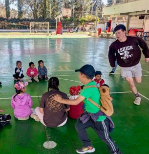 Nate and his fellow church members played games with the kids and taught them some new skills, including some English and chess on the phone app.