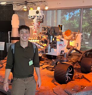 Jack Riffle with Mars Rover model at JPL