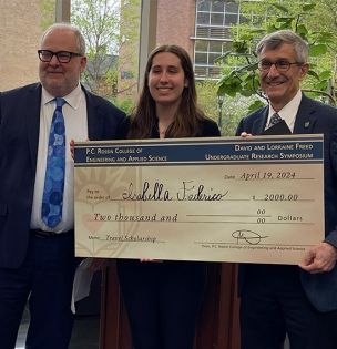 Dean Steve DeWeerth, Isabella Federico, and President Joe Helble during the award ceremony
