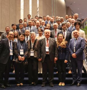 Dan Frangopol joins an international group of colleagues researchers and former students for a group photo at a symposium honoring his career in Tokyo Japan.