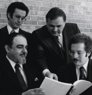 Lehigh professor David Van Horn points at a booklet while in conversation at a conference in 1979.