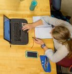 Overhead shot of woman using laptop