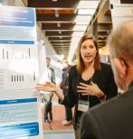 Student presenting at research symposium