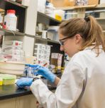 student in research lab