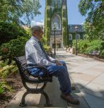  Michael Yonkovig looks towards Packard Lab while sitting outside the Alumni Memorial Building during a campus visit in August. (Photo by Christa Neu / Lehigh University)