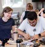 Kelly Zona advises bootcamp participant working on project