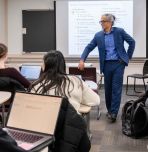 Bilal Khan, professor of biostatistics and health data science and professor in the Department of Computer Science and Engineering, listens to a student during one of his classes.