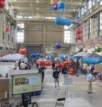 Drones with Mylar balloons compete in high bay in Building C