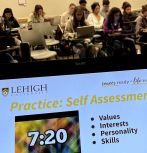 Tablet screen showing career development education in classroom with students in the background