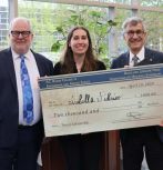 Dean Steve DeWeerth, Isabella Federico, and President Joe Helble during the award ceremony