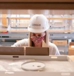 Professor Angela Brown unpacks boxes in new lab in Lehigh's HST building