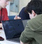 Lehigh Hacks for Justice participant working on laptop