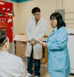 Prof. Helen Chan works with graduate students in her lab 