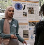 Student presenting poster at 2024 UGRS