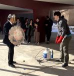 Professor Castro and students testing out shield