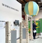 Paolo Bocchini speaks in front of exhibit on 3D-printed concrete