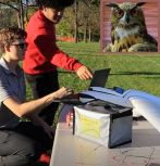 students working on RC airplane