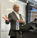 Rudy Shankar presenting at lectern