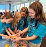 a group of CHOICES participants interact with a STEM squad mentor