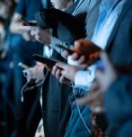 Photo of people looking at phones by camilo jimenez on Unsplash
