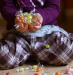 Child picking up candy