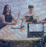 Students at table with laptop discussing data science