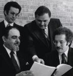 Lehigh professor David Van Horn points at a booklet while in conversation at a conference in 1979.
