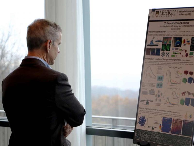 Man reading poster